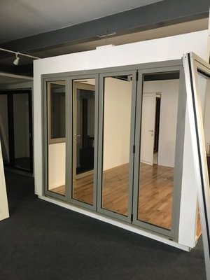 Bifold door installation - Bifold door installation involves fitting a set of hinged panels into a door frame to fold neatly to one side when opened. The process includes mounting a top track and bottom pivot bracket, aligning the panels for smooth operation, and adjusting them for a perfect fit. This installation enhances space efficiency and adds a modern touch to any room.