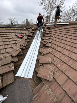 Valley flashing replacement - Old single rib valley flashing replaced with new  “3 ribbed valley flashing “. We upgraded the flashing with a more durable system that will hold debris for a longer time than a single rib valley. These new valleys can last without cleaning 2-3 years more than a standard valley flashing.