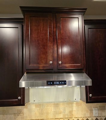 Kitchen Range Hood Installation - Mechanicsburg, PA - Customer requested that the existing microwave/exhaust combo be removed and replace with a new stainless steel range hood, with exhaust vented to the exterior of the home. Customer selected and purchased the range hood directly from the retailer and York Electrical Services provided removal and disposable of microwave/exhaust combo and installation of new range hood and exterior vent. Kitchen Range Hood Installation - Mechanicsburg, PA - Customer requested that the existing microwave/exhaust combo be removed and replace with a new stainless steel range hood, with exhaust vented to the exterior of the home. Customer selected and purchased the range hood directly from the retailer and York Electrical Services provided removal and disposable of microwave/exhaust combo and installation of new range hood and exterior vent.
