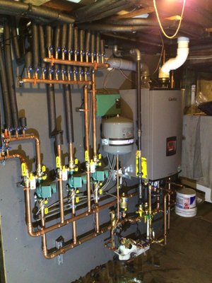 Oil to Gas Conversion - This oil to gas conversion was done in Rockville Centre. We took the old oil setup and upgraded it to a new gas Lochinvar wall hanging boiler. Our team started to assemble the new set up in our shop before we transferred it to the customer's home to connect and finish. Oil to Gas Conversion - This oil to gas conversion was done in Rockville Centre. We took the old oil setup and upgraded it to a new gas Lochinvar wall hanging boiler. Our team started to assemble the new set up in our shop before we transferred it to the customer's home to connect and finish.