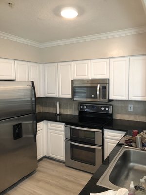 Kitchen Cabinets to White - Kitchen sanded, primed and painted white Kitchen Cabinets to White - Kitchen sanded, primed and painted white
