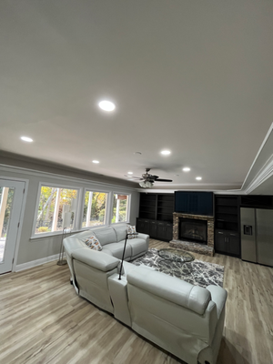 Basement Upgrade - Installation of recessed lighting, ceiling fan and TV mounting with concealed wiring.