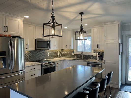 Kitchen remodel - This renovation was done to open up floor space in the upstairs of home, added a beam to attic before removal of 2 load bearing walls, closed up hole in wall and floor that was access to garage. New shiplap ceiling with crown molding, added new light throughout home. New pre-hung interior doors with trim. New flooring finished of with 6” base molding. New kitchen cabinets and backsplash with under cabinet lighting. New sliding door and windows. Kitchen remodel - This renovation was done to open up floor space in the upstairs of home, added a beam to attic before removal of 2 load bearing walls, closed up hole in wall and floor that was access to garage. New shiplap ceiling with crown molding, added new light throughout home. New pre-hung interior doors with trim. New flooring finished of with 6” base molding. New kitchen cabinets and backsplash with under cabinet lighting. New sliding door and windows.