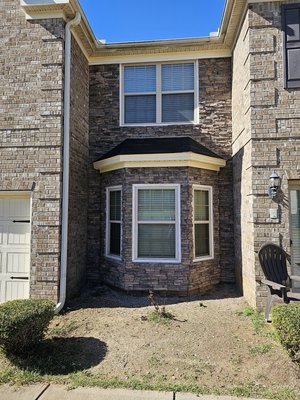roof and wall repair - Customer called with a leaking roof and desire to replace the stone on this exterior wall. We found no flashing on the roof and some rotten sheathing and rafters. We replaced all the rotten wood, wet insulation and sheathing. A new roof, flashing, stone, facia and soffit gave this home a great new look. We look forward to working with this client in the future. Call for a free estimate.