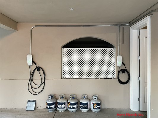 Tesla Wall Connector - Installation two Tesla Wall Connector and Sub Panel inside the garage. There is an existing 200 amp inside the laundry room on second story , we had to bring our conductors down to the garage and install the second sub panel to feed two Tesla Wall connector.