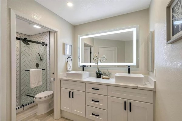 Bathroom Remodel - Completely updated bathroom.  Renovated completely expanded shower pan to make more room for shower area.   Installed new exhaust fan, and new ceiling lights.