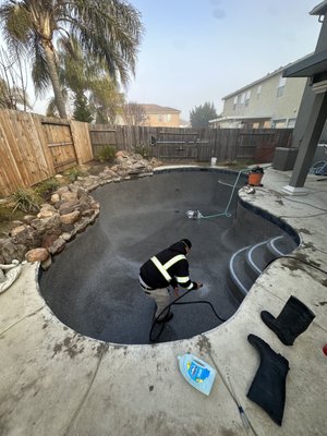 Pool plastering - Black mini pebble finish with new 6x6 waterline tile. Quick and simple resurface in Elk Grove, Ca.