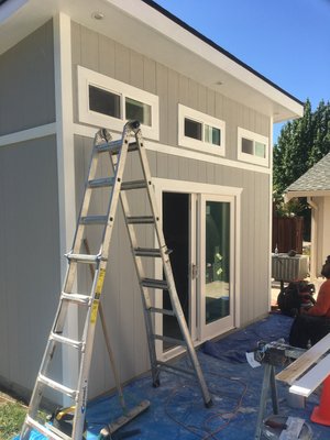 Backyard office/Shed - This was an office build. It was 12x14 and have a front wall height of 11 feet and a rear wall height of 10 feet. We built it from the ground up and completed the exterior. Client wanted to finish the inside himself because he also enjoys working with his hands.