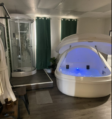 Float Spa - A floatation tank, also known as an isolation tank or sensory deprivation pod, is a zero-gravity environment designed to help your mind and body relax, recover, and reset. When you begin your floatation therapy session, you'll enter a clean and serene environment eliminating external stimuli. Enjoy a steam shower prior to entering the float spa. After showering you will enter the pod to float in 10" of high epsom salt content water. The water is fully buoyant and the pod is sound proofed to leave you with a weightless peaceful experience. Float Spa - A floatation tank, also known as an isolation tank or sensory deprivation pod, is a zero-gravity environment designed to help your mind and body relax, recover, and reset. When you begin your floatation therapy session, you'll enter a clean and serene environment eliminating external stimuli. Enjoy a steam shower prior to entering the float spa. After showering you will enter the pod to float in 10" of high epsom salt content water. The water is fully buoyant and the pod is sound proofed to leave you with a weightless peaceful experience.