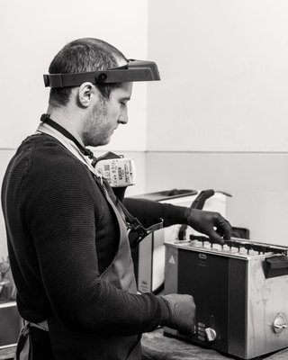 Meet The Makers: Ben - Let us introduce you to our polisher, Ben
From the rarest, most beautiful gemstones to the most minute customisable fixtures on our fine jewelry pieces, so much care and attention is paid to the very last detail. The same goes for every part of our production process. Our London workshop is filled with masterful craftspeople who ensure every piece that passes through gets as much TLC as possible at every stage.
One of those stages is the all-important polishing stage. Each piece is buffed, sheened and polished to perfection before it’s placed in its velvet box and sent to you. At Taylor & Hart, the person responsible for this finishing touch is our polisher, Ben.
After having gained invaluable experience during his apprenticeship and previous industry roles, he’s been the go-to smooth operator at Taylor & Hart for the past two years. We get the scoop on what a mop really is, why tanzanite is volatile when wet, and how important it is to mind your fingers.
https://taylorandhart.com/blog/meet-the-makers-ben Meet The Makers: Ben - Let us introduce you to our polisher, Ben
From the rarest, most beautiful gemstones to the most minute customisable fixtures on our fine jewelry pieces, so much care and attention is paid to the very last detail. The same goes for every part of our production process. Our London workshop is filled with masterful craftspeople who ensure every piece that passes through gets as much TLC as possible at every stage.
One of those stages is the all-important polishing stage. Each piece is buffed, sheened and polished to perfection before it’s placed in its velvet box and sent to you. At Taylor & Hart, the person responsible for this finishing touch is our polisher, Ben.
After having gained invaluable experience during his apprenticeship and previous industry roles, he’s been the go-to smooth operator at Taylor & Hart for the past two years. We get the scoop on what a mop really is, why tanzanite is volatile when wet, and how important it is to mind your fingers.
https://taylorandhart.com/blog/meet-the-makers-ben