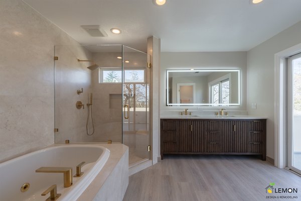 Modern Spa Bathroom Remodel | Tub + Walk-In Shower - Step inside this stunning luxury bathroom remodel in the Bay Area, where modern design meets high-end functionality. This full transformation showcases a spa-like master bathroom featuring a custom double vanity, a freestanding soaking tub, and a sleek frameless glass walk-in shower.
The centerpiece of this remodel is the elegant freestanding bathtub paired with a built-in fireplace, creating a true relaxation space inside your home. The bathroom also includes a custom wood vanity with vertical slat design, quartz countertops, and premium gold fixtures for a warm, upscale finish.
Natural light flows through large sliding glass doors, enhancing the open layout and connecting indoor comfort with outdoor views. The addition of a backlit LED mirror, modern tile flooring, and neutral-tone large-format wall tiles creates a clean, timeless look that will stay stylish for years.
✨ Key Features in This Bathroom Remodel:
Freestanding soaking tub with modern gold fixtures
Built-in fireplace next to the tub for a luxury spa feel
Frameless glass walk-in shower with rainfall showerhead
Custom double vanity with designer wood slat cabinetry
Quartz countertops with integrated sinks
Backlit LED mirror for a modern touch
Large-format tile walls and flooring
Sliding glass door bringing in natural light
Separate toilet room for added privacy
Whether you're planning a bathroom renovation, master bathroom upgrade, or full home remodel, this project is a great example of how thoughtful design and quality craftsmanship can completely transform a space.
At Lemon Remodeling, we specialize in high-end bathroom remodeling, ADUs, and full home renovations across the Bay Area. From design to build, we handle everything. Modern Spa Bathroom Remodel | Tub + Walk-In Shower - Step inside this stunning luxury bathroom remodel in the Bay Area, where modern design meets high-end functionality. This full transformation showcases a spa-like master bathroom featuring a custom double vanity, a freestanding soaking tub, and a sleek frameless glass walk-in shower.
The centerpiece of this remodel is the elegant freestanding bathtub paired with a built-in fireplace, creating a true relaxation space inside your home. The bathroom also includes a custom wood vanity with vertical slat design, quartz countertops, and premium gold fixtures for a warm, upscale finish.
Natural light flows through large sliding glass doors, enhancing the open layout and connecting indoor comfort with outdoor views. The addition of a backlit LED mirror, modern tile flooring, and neutral-tone large-format wall tiles creates a clean, timeless look that will stay stylish for years.
✨ Key Features in This Bathroom Remodel:
Freestanding soaking tub with modern gold fixtures
Built-in fireplace next to the tub for a luxury spa feel
Frameless glass walk-in shower with rainfall showerhead
Custom double vanity with designer wood slat cabinetry
Quartz countertops with integrated sinks
Backlit LED mirror for a modern touch
Large-format tile walls and flooring
Sliding glass door bringing in natural light
Separate toilet room for added privacy
Whether you're planning a bathroom renovation, master bathroom upgrade, or full home remodel, this project is a great example of how thoughtful design and quality craftsmanship can completely transform a space.
At Lemon Remodeling, we specialize in high-end bathroom remodeling, ADUs, and full home renovations across the Bay Area. From design to build, we handle everything.