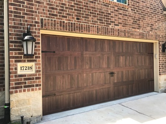 New Accent Woodtones garage door installation - This garage door replacement was done to update the curb appeal of the home and add a gorgeous garage door to the front of the home.