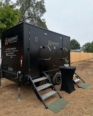 2-Stall Luxury Restroom Trailer - Our 2-stall luxury restroom trailer is the perfect option for intimate gatherings and smaller events where comfort and presentation still matter. Inside, guests enjoy two fully private, locking restroom rooms designed to feel like an upscale indoor restroom rather than a typical portable unit. The trailer features a sleek black exterior and a bright, modern interior that fits beautifully into weddings, backyard celebrations, and private parties.
Each stall includes a flushing toilet, sink with running water, mirror, interior lighting, and full climate control. Every rental is stocked with high-quality paper products and our signature craft soaps, lotions, and reed diffusers. Generator service and water filling are always included at no additional cost, and we handle delivery, setup, and pickup for a stress-free experience.
Ideal for events with approximately 50–100 guests. 2-Stall Luxury Restroom Trailer - Our 2-stall luxury restroom trailer is the perfect option for intimate gatherings and smaller events where comfort and presentation still matter. Inside, guests enjoy two fully private, locking restroom rooms designed to feel like an upscale indoor restroom rather than a typical portable unit. The trailer features a sleek black exterior and a bright, modern interior that fits beautifully into weddings, backyard celebrations, and private parties.
Each stall includes a flushing toilet, sink with running water, mirror, interior lighting, and full climate control. Every rental is stocked with high-quality paper products and our signature craft soaps, lotions, and reed diffusers. Generator service and water filling are always included at no additional cost, and we handle delivery, setup, and pickup for a stress-free experience.
Ideal for events with approximately 50–100 guests.