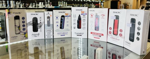 Vapes - If you want an alternative to traditional smoking, then vapes could be the perfect option. Not only do vapes provide the incredible sensation of vaping without tobacco, but they also come with fewer health risks than cigarettes. Here at our smoke shop, we are proud to offer a massive selection of vapes, such as pod vapes, from some of the best brands in the industry. In addition, all products are tested and verified before landing in your hands, so you can vape confidently, knowing that what you're enjoying is high quality! Visit us today to check out our selection of vapes. Vapes - If you want an alternative to traditional smoking, then vapes could be the perfect option. Not only do vapes provide the incredible sensation of vaping without tobacco, but they also come with fewer health risks than cigarettes. Here at our smoke shop, we are proud to offer a massive selection of vapes, such as pod vapes, from some of the best brands in the industry. In addition, all products are tested and verified before landing in your hands, so you can vape confidently, knowing that what you're enjoying is high quality! Visit us today to check out our selection of vapes.