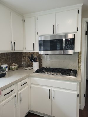 Adding cabinet handles. - Upgrade your home with new cabinet handles. Adding cabinet handles. - Upgrade your home with new cabinet handles.