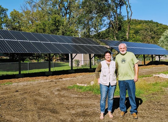 La Crosse, WI - We had the pleasure of working with these homeowners to install a solar ground mount array in their backyard. It required a good amount of trenching to bring the power to the panel. After one year, they have fully landscaped the area and it looks beautiful. The array blends in seamlessly with their in town oasis. La Crosse, WI - We had the pleasure of working with these homeowners to install a solar ground mount array in their backyard. It required a good amount of trenching to bring the power to the panel. After one year, they have fully landscaped the area and it looks beautiful. The array blends in seamlessly with their in town oasis.