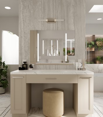A Modern Bath Transformation - This bathroom was extremely outdated with its original 1980s tile work, cramped layout, and dated fixtures shown in the before photos. The space felt cluttered and closed-off, with the old mosaic tile surround dominating the room and creating a heavy, dated appearance. Completely reimagining the layout and removing the bulky tile work opened up the space to allow a luxurious, spa-like feeling that transformed the once claustrophobic environment.
We included a dedicated makeup vanity area and floating double vanity to incorporate significantly more storage while creating distinct zones for the busy professionals to enjoy their daily routines. The warm taupe cabinetry was a sophisticated upgrade from the original beige cabinetry, and the stunning marble surfaces replaced the small mosaic tiles to create a timeless, elegant aesthetic. The new freestanding soaking tub became a dramatic focal point, replacing the old built-in tub surround. The remodeled bathroom now functions beautifully for the couple to enjoy their morning and evening routines while providing a serene, hotel-like escape that feels completely transformed from its original 1980s design. A Modern Bath Transformation - This bathroom was extremely outdated with its original 1980s tile work, cramped layout, and dated fixtures shown in the before photos. The space felt cluttered and closed-off, with the old mosaic tile surround dominating the room and creating a heavy, dated appearance. Completely reimagining the layout and removing the bulky tile work opened up the space to allow a luxurious, spa-like feeling that transformed the once claustrophobic environment.
We included a dedicated makeup vanity area and floating double vanity to incorporate significantly more storage while creating distinct zones for the busy professionals to enjoy their daily routines. The warm taupe cabinetry was a sophisticated upgrade from the original beige cabinetry, and the stunning marble surfaces replaced the small mosaic tiles to create a timeless, elegant aesthetic. The new freestanding soaking tub became a dramatic focal point, replacing the old built-in tub surround. The remodeled bathroom now functions beautifully for the couple to enjoy their morning and evening routines while providing a serene, hotel-like escape that feels completely transformed from its original 1980s design.