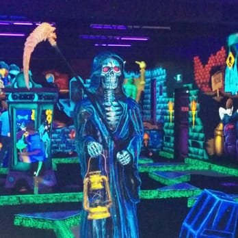 Mini Golf - Our glow in the dark mini golf courses are sure to entertain you as you make your way through 18 holes with only the best monsters and creatures around. As you wind your way through the course, you’ll get a taste of local flavor with our hand-painted artwork depicting sites and symbols unique to the area. It’s going to be a spooktacular good time! Mini Golf - Our glow in the dark mini golf courses are sure to entertain you as you make your way through 18 holes with only the best monsters and creatures around. As you wind your way through the course, you’ll get a taste of local flavor with our hand-painted artwork depicting sites and symbols unique to the area. It’s going to be a spooktacular good time!