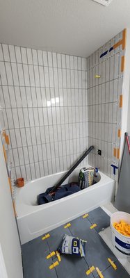 Parker Bathroom Remodel - This bathroom had old finishes, tile, and leaking toilet. Updated shower wall tile, added a nice niche, and new shower valve. Installed new tile floor, new toilet, light fixture. Satisfied and happy client!