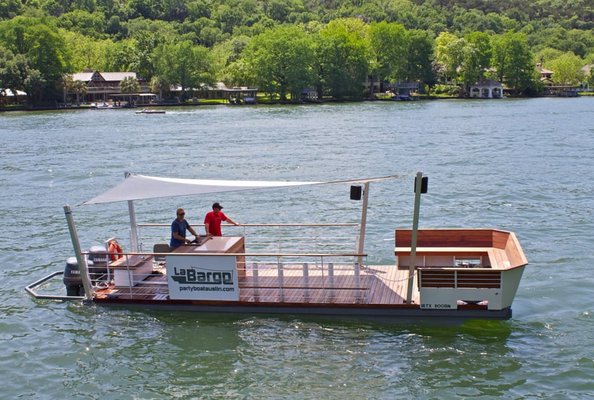 The LaBarge - Party Boat Austin is your premier chartered boat (La Barge) for Lake Austin! It not only has style and class, but is furnished for a great time. It has over 300 square feet of deck space and can comfortably accommodate 20+ people with plenty of space for anything you may need to bring on board. It is great for all types of occasions, ages, and events. The La Barge is equipped with everything you'll need for a good time including a bar area, stereo with iPod connectivity, a captain, bench seating & bar stools. An ice chest is available upon request. We also have 110 volt outlets so you can fire up your blenders. Bring your sunscreen or tanning oil and prepare yourself for a great time!

www.BigTexBoatRentals.com