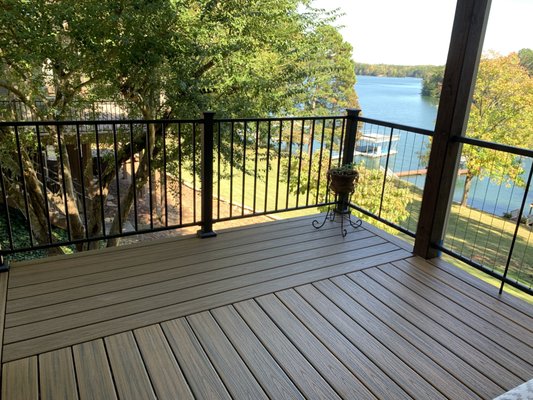 Lake House Deck Renovation - This customer chose a real top-of-the-line renovation by going with Trex Transcend decking and Fortress Vertical Cable Railing and standard iron panels. It really opened up their view of the lake and created a maintenance free leisure area.