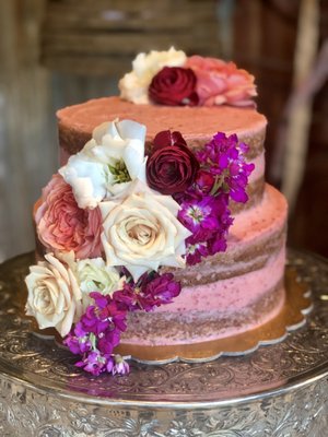 Wedding Cakes - The wedding cake is a rather special cake for a very special occasion. I have been honored with the request of doing the cakes and/or desserts for three weddings so far. I have done rustic style naked cakes with fresh flowers and/or edible flowers and one order had cupcakes to match. I would love to work with you for your wedding!!! I offer a complimentary cake tasting to decide on the flavor(s) you want most and also give you a free mini version of your cake on the one year anniversary of your wedding. No offense to tradition, but a fresh cake would taste ten times better than a year old freezer burn cake. At this time I do not take requests for fondant cakes, however. I understand it is a traditional pristine look for a wedding cake, but since I personally have not been a fan of the texture & flavor of fondant I am not familiar with that style. If that is your desire I will happily book a consultation with you to see if we can work together & if it comes down to it will offer you the best recommendations I have for that style. Weddings don’t always mean cakes either! I do dessert tables as well!! Wedding Cakes - The wedding cake is a rather special cake for a very special occasion. I have been honored with the request of doing the cakes and/or desserts for three weddings so far. I have done rustic style naked cakes with fresh flowers and/or edible flowers and one order had cupcakes to match. I would love to work with you for your wedding!!! I offer a complimentary cake tasting to decide on the flavor(s) you want most and also give you a free mini version of your cake on the one year anniversary of your wedding. No offense to tradition, but a fresh cake would taste ten times better than a year old freezer burn cake. At this time I do not take requests for fondant cakes, however. I understand it is a traditional pristine look for a wedding cake, but since I personally have not been a fan of the texture & flavor of fondant I am not familiar with that style. If that is your desire I will happily book a consultation with you to see if we can work together & if it comes down to it will offer you the best recommendations I have for that style. Weddings don’t always mean cakes either! I do dessert tables as well!!