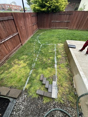 Backyard Remodel 5/1/25 - We installed a paver walkway to enhance both function and curb appeal. Black lawn edging was added to define the lawn shape, and fresh bark dust was applied to give the landscape a clean, finished look.
