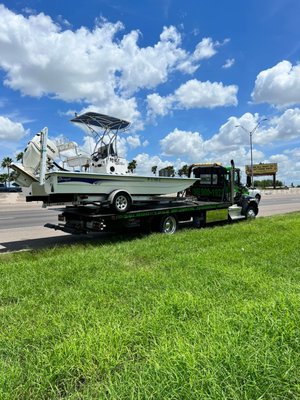 Capital Towing LLC towing a boat - We towed this boat and trailer that the tire fell off we have equipment to tow anything safely with trained professional staff. Capital Towing LLC towing a boat - We towed this boat and trailer that the tire fell off we have equipment to tow anything safely with trained professional staff.