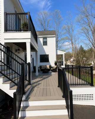 Modern Outdoor Deck – Seamless Living Space - Custom-built deck blends durability with design, creating a welcoming extension of the home. Crafted with premium materials and clean architectural lines, it offers a versatile space for both relaxation and entertaining. The layout maximizes natural light and airflow, while the sturdy construction ensures long-lasting performance. Perfect for family gatherings, quiet evenings, or weekend celebrations, this deck elevates outdoor living and adds timeless value to the property.