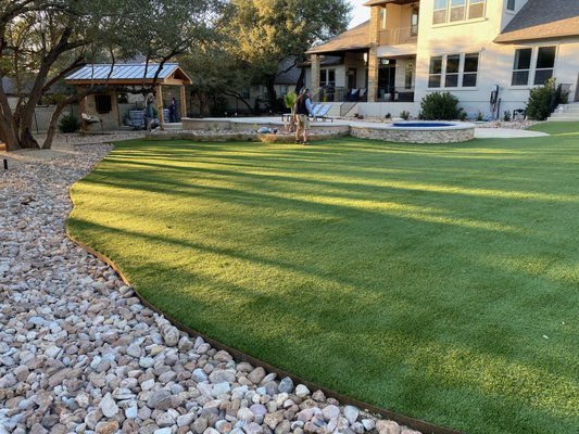 Smart Turf Around Pool - Smart Turf was selected to install artificial grass in this spacious backyard. Turf around the pool is an excellent compliment to concrete, pavers, and stones. Smart Turf Around Pool - Smart Turf was selected to install artificial grass in this spacious backyard. Turf around the pool is an excellent compliment to concrete, pavers, and stones.
