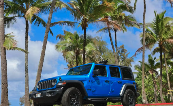 Da Whale - Jeep Wrangler Sport - Discover the Big Island in style with our Jeep Wrangler Unlimited rental in Hilo, Hawaii! This rugged, convertible Jeep is perfect for island exploration, featuring all-wheel drive, brake assist, Bluetooth connectivity, AUX/USB inputs, and waterproof mats and seat covers—ideal for all your adventures. Skip the rental counter and enjoy app-based pickup and return, free additional drivers, a 30-minute grace period, and 24/7 roadside assistance and support—all included in your price. Make your trip even more enjoyable with optional add-ons like prepaid refueling, snorkeling gear, coolers, child seats, a body board, full beach setup, and Kona one-way pickup or delivery. Book today for a safe, convenient, and unforgettable Hawaiian journey! Da Whale - Jeep Wrangler Sport - Discover the Big Island in style with our Jeep Wrangler Unlimited rental in Hilo, Hawaii! This rugged, convertible Jeep is perfect for island exploration, featuring all-wheel drive, brake assist, Bluetooth connectivity, AUX/USB inputs, and waterproof mats and seat covers—ideal for all your adventures. Skip the rental counter and enjoy app-based pickup and return, free additional drivers, a 30-minute grace period, and 24/7 roadside assistance and support—all included in your price. Make your trip even more enjoyable with optional add-ons like prepaid refueling, snorkeling gear, coolers, child seats, a body board, full beach setup, and Kona one-way pickup or delivery. Book today for a safe, convenient, and unforgettable Hawaiian journey!
