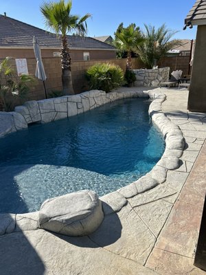 Custom build heated pool - Custom build mid size pool with artificial rock coping and slide