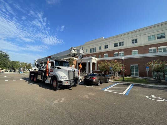 Installation of Roofing Material - Lifting insulation and roofing material to the top of Town Hall.