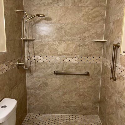 Tub to shower conversion - The goal was to remove the existing tub and make a walk in shower enclosure that the customer's elderly father could safely access. The home health nurse provided feed back on where the two ADA certified should be installed for her patient. Those areas where reinforced with 2x10 boards behind the walls for added safety and peace of mind. Tub to shower conversion - The goal was to remove the existing tub and make a walk in shower enclosure that the customer's elderly father could safely access. The home health nurse provided feed back on where the two ADA certified should be installed for her patient. Those areas where reinforced with 2x10 boards behind the walls for added safety and peace of mind.