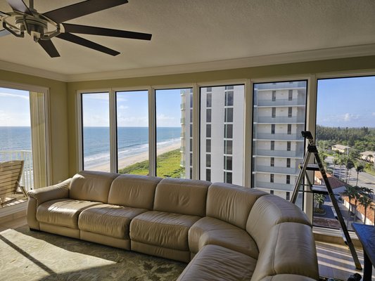 Blackout Cellular Shades Before & After - One of our customers enjoys a stunning ocean view through large, sun-filled windows that flood their space with natural light during the day. While the bright, open atmosphere is perfect for enjoying the scenery, they also wanted the flexibility to create a private, cozy environment in the evening. Royal Shades & Blinds delivered the ideal solution by installing motorized blackout cellular shades. During the day, the shades can be easily raised to showcase the breathtaking ocean views, and at night, they effortlessly lower to provide complete darkness and privacy in the seating area. The motorized function adds modern convenience, allowing the customer to transition their space from bright and airy to calm and secluded with the touch of a button.