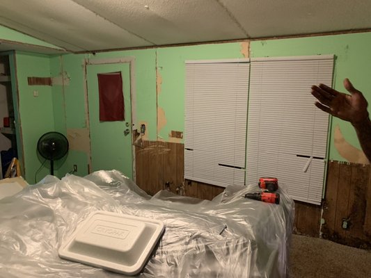 Demolition and Drywall hanging and finishing - So this job was done on a mobile home that was built in 87. It had all of the original wood paneling and insulation in it as well. I started out by gutting out the walls,ceiling ,and having to add a little framing in here and there. The homeowner also wanted a bar space added onto an existing wall so I cut that out and made it to their desire. We put in new insulation and put our Sheetrock in also doing a modern casing around the windows (for sharp edges) . After three coats of mud and some sanding the job was completed and the homeowner was more than pleased with the work of Mishoe’s Handy Services!!