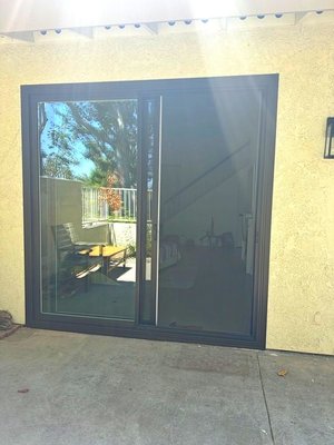 Exterior Architectural Bronze Frame Sliding Patio Door And Window Installation In Orange, CA - Harbor Construction proudly presents our latest project in Orange, CA – the installation of exterior architectural bronze frame sliding patio doors and windows. This premium upgrade brings sophistication and elegance to the home’s exterior, enhancing curb appeal and functionality. Our team meticulously installed Anlin’s top-quality products, known for their durability and energy efficiency. Collaborating closely with the homeowner, we ensured a seamless fit and minimal disruption throughout the installation process. The result? A stunning transformation that exceeds expectations. Elevate your home’s style with Harbor Construction’s expert window and door installations.