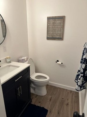 Bathroom remodel - Updated the vanity, floors and trim and applied a fresh coat of paint. Bathroom remodel - Updated the vanity, floors and trim and applied a fresh coat of paint.