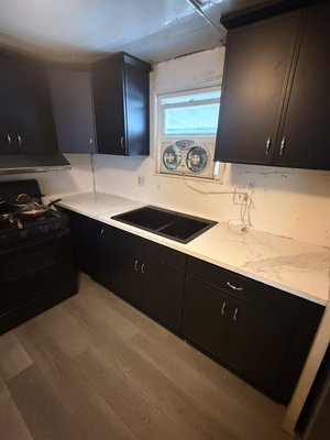New countertop on small kitchen - Replace old granite top with new quarts material New countertop on small kitchen - Replace old granite top with new quarts material