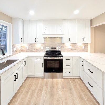 Kitchen Renovation - Rockville, Maryland - Reconfigured layout, structural updates, a new window and entry door, upgraded HVAC, plumbing, and electrical systems, updated lighting, new flooring throughout, a redesigned kitchen with new cabinetry, quartz countertops, tile backsplash, appliance installation, and a fresh interior paint finish. Kitchen Renovation - Rockville, Maryland - Reconfigured layout, structural updates, a new window and entry door, upgraded HVAC, plumbing, and electrical systems, updated lighting, new flooring throughout, a redesigned kitchen with new cabinetry, quartz countertops, tile backsplash, appliance installation, and a fresh interior paint finish.