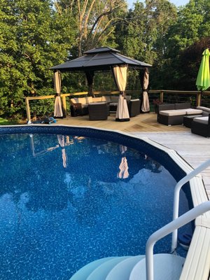 Aboveground pool projects - Aboveground pools are an affordable way to create a backyard oasis for your family. We offer a variety of sizes and shapes to suit your needs. Energy efficient models cut your costs while our Radiant pools offer space age design for modern installations. Add a custom deck built around the shape of the pool and you will have with a stunning backyard get away. With an easy to care for vinyl liner and robust filtration system, this pool is not only beautiful but also offers a simple care routine. Aboveground pool projects - Aboveground pools are an affordable way to create a backyard oasis for your family. We offer a variety of sizes and shapes to suit your needs. Energy efficient models cut your costs while our Radiant pools offer space age design for modern installations. Add a custom deck built around the shape of the pool and you will have with a stunning backyard get away. With an easy to care for vinyl liner and robust filtration system, this pool is not only beautiful but also offers a simple care routine.