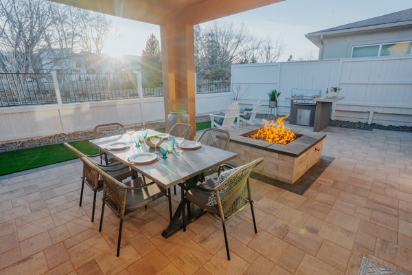 Sophisticated Backyard Oasis with Custom Features and Pet-Friendly Design - Project Overview:
We recently completed a comprehensive backyard renovation, transforming an ordinary space into a sophisticated outdoor oasis tailored to the homeowners and their cherished French Bulldog, Rocko. This project showcases the seamless integration of functional elegance and personalized features, including premium Catalina Grana pavers, a pet-friendly artificial turf area, natural rock planters, a state-of-the-art outdoor kitchen, and a large, inviting firepit.
Features Installed:
Catalina Grana Pavers: We laid down Catalina Grana pavers in the shade of Aspen with a striking Graphite border, creating a visually appealing and durable foundation that ties the entire outdoor area together.
Artificial Turf for Rocko the Frenchie: Dedicated to providing a safe and enjoyable space for Rocko, we installed a section of top-quality artificial turf. This low-maintenance area allows for worry-free play and relaxation for the family's beloved pet.
Natural Rock Planters: The addition of natural rock planters introduces an element of organic beauty, housing an array of vibrant plants and flowers that enhance the space's aesthetic appeal and biodiversity.
Custom Outdoor Kitchen: Our bespoke outdoor kitchen is a culinary enthusiast's dream, equipped with the latest appliances, spacious countertops, and integrated storage solutions. It's designed to facilitate effortless outdoor dining and entertaining.
Large Firepit: As a focal point for evening gatherings, we added a large firepit that not only enhances the ambiance but also provides warmth and light. This feature creates a cozy atmosphere, encouraging relaxation and social interaction under the stars.
Project Challenges and Solutions:
Balancing aesthetics with functionality was a key challenge in this project, especially with the diverse elements involved. Our design strategy focused on creating distinct zones within the backyard that flow together harmoniously. The inclusion of the firepit required careful consideration of safety and seating arrangements, ensuring it complemented the overall design while providing a functional gathering space.
Conclusion:
This backyard renovation exemplifies our dedication to crafting spaces that reflect our clients' unique lifestyles and preferences. From the pet-friendly considerations for Rocko to the addition of a luxurious outdoor kitchen and a captivating firepit, every detail was meticulously planned and executed to create an outdoor oasis that is both beautiful and functional.
Contact Us:
If you're inspired to transform your backyard into a bespoke outdoor paradise, we're here to help. Contact us to explore how we can bring your vision to life with our custom landscaping and design services. Sophisticated Backyard Oasis with Custom Features and Pet-Friendly Design - Project Overview:
We recently completed a comprehensive backyard renovation, transforming an ordinary space into a sophisticated outdoor oasis tailored to the homeowners and their cherished French Bulldog, Rocko. This project showcases the seamless integration of functional elegance and personalized features, including premium Catalina Grana pavers, a pet-friendly artificial turf area, natural rock planters, a state-of-the-art outdoor kitchen, and a large, inviting firepit.
Features Installed:
Catalina Grana Pavers: We laid down Catalina Grana pavers in the shade of Aspen with a striking Graphite border, creating a visually appealing and durable foundation that ties the entire outdoor area together.
Artificial Turf for Rocko the Frenchie: Dedicated to providing a safe and enjoyable space for Rocko, we installed a section of top-quality artificial turf. This low-maintenance area allows for worry-free play and relaxation for the family's beloved pet.
Natural Rock Planters: The addition of natural rock planters introduces an element of organic beauty, housing an array of vibrant plants and flowers that enhance the space's aesthetic appeal and biodiversity.
Custom Outdoor Kitchen: Our bespoke outdoor kitchen is a culinary enthusiast's dream, equipped with the latest appliances, spacious countertops, and integrated storage solutions. It's designed to facilitate effortless outdoor dining and entertaining.
Large Firepit: As a focal point for evening gatherings, we added a large firepit that not only enhances the ambiance but also provides warmth and light. This feature creates a cozy atmosphere, encouraging relaxation and social interaction under the stars.
Project Challenges and Solutions:
Balancing aesthetics with functionality was a key challenge in this project, especially with the diverse elements involved. Our design strategy focused on creating distinct zones within the backyard that flow together harmoniously. The inclusion of the firepit required careful consideration of safety and seating arrangements, ensuring it complemented the overall design while providing a functional gathering space.
Conclusion:
This backyard renovation exemplifies our dedication to crafting spaces that reflect our clients' unique lifestyles and preferences. From the pet-friendly considerations for Rocko to the addition of a luxurious outdoor kitchen and a captivating firepit, every detail was meticulously planned and executed to create an outdoor oasis that is both beautiful and functional.
Contact Us:
If you're inspired to transform your backyard into a bespoke outdoor paradise, we're here to help. Contact us to explore how we can bring your vision to life with our custom landscaping and design services.