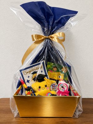 2026 Preschool graduation gift bag - 2026 Preschool graduation gift bag to celebrate Toby’s big sister’s big milestone! The gift bag includes a graduate star, graduate duck bath toy, coloring book, multi-colored crayons, colored scratchers with wooden pencil, stamp, stickers, and bubbles wrapped beautifully in clear cellophane, blue sparkled tissue paper, blue and gold paper cuts, and tied neatly with a gold satin bow.