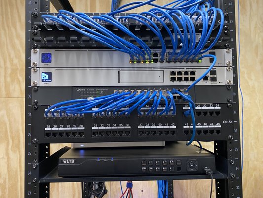 New Network Setup - The original network was only run by WIFI and had a UDM, NVR, and switch with no credentials. We added network ports to all the cubicles and offices by running Cat6 throughout. We added an AC DC server to have control over users and permissions and added a second server for backup. We added a NAS for backups and reconfigured the Ubiquiti switch, the NVR, and the UDM as no one had credentials to access any of them. We replaced the UDM with a Cisco Meraki firewall. Finally, we configured all the computers, added software, data, and settings to all computers, and trained their IT administrator on the network. New Network Setup - The original network was only run by WIFI and had a UDM, NVR, and switch with no credentials. We added network ports to all the cubicles and offices by running Cat6 throughout. We added an AC DC server to have control over users and permissions and added a second server for backup. We added a NAS for backups and reconfigured the Ubiquiti switch, the NVR, and the UDM as no one had credentials to access any of them. We replaced the UDM with a Cisco Meraki firewall. Finally, we configured all the computers, added software, data, and settings to all computers, and trained their IT administrator on the network.