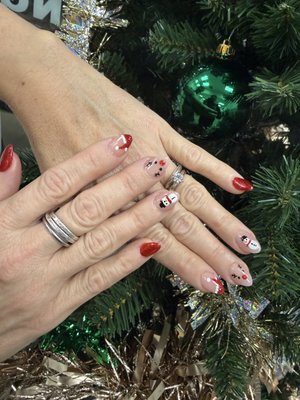 Christmas nails? - Browse our portfolio of recent Christmas nail sets! We feature everything from elegant winter whites and shimmering golds to fun, detailed holiday characters. See something you love? Mention the design when you book your next manicure or pedicure with us! Christmas nails? - Browse our portfolio of recent Christmas nail sets! We feature everything from elegant winter whites and shimmering golds to fun, detailed holiday characters. See something you love? Mention the design when you book your next manicure or pedicure with us!