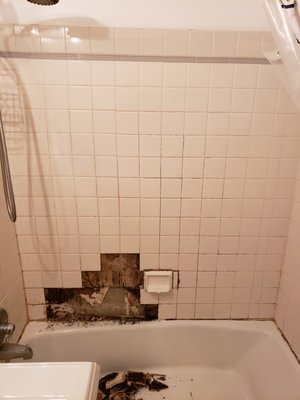 NYC white 4×4 shower tile repair and regrout. - This shower re-grout project presented an unexpected challenge. While removing the old grout, our technicians noticed some loose tiles, indicating a deeper issue.To ensure a long-lasting and watertight result, we promptly addressed the problem: Removed the damaged wall substrate, Installed a new cement board for a solid foundation.Re-tiled the affected area.This unforeseen work added a day to the project, but our commitment to quality and customer satisfaction remained unwavering.The final result? A beautifully regrouted shower with 100% silicone caulk around the perimeter for superior water sealing. 

#ShowerRegrout #TileRepair #HomeRenovation #AttentionToDetail #CustomerSatisfaction.