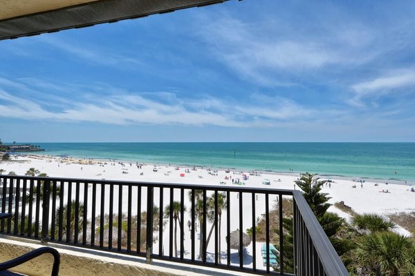 Beach Front Properties - Sea Shell Beachfront Condos

All four of the Sea Shell beachfront condos are as close to the beach as you can get in Siesta Key. Each has a private balcony that overlooks the white sands and clear, turquoise waters of the world-famous Siesta Key Beach.

You can read more about the Penthouse unit here, as it has a larger footprint than units 101, 201 and 301. Those latter three units all have two bedrooms and two baths and sleep six. Wi-Fi is always included with all rentals.

Here are more details about the three lower-level Sea Shell Beachfront condos.

Unit 101: Our most convenient ocean view unit, Sea Shell Condo 101 is popular with those who want to be on the beach FAST. Just a few steps or a quick elevator ride down, then it’s a few more steps through the gate to our private beach. The wraparound balcony offers gorgeous views of the Gulf of Mexico and is a wonderful place to relax and people watch.

The kitchen is fully equipped for meals and dining, with attractive granite countertops and stainless-steel appliances. The unit sleeps six, with a king bed in the master and two double beds in the second room. There are TVs in each room, including a large flat screen TV and DVD player in the living room. Both bathrooms have a shower and a tub. The unit has been freshly painted, with vibrant new décor and furniture throughout.

Unit 201: This unit is newly remodeled with bright, modern furnishings and an updated open floor plan. You might not want to spend much time inside, though – the beautiful views from the wraparound balcony are hard to resist.

As with all of the Sea Shell beachfront condos, 201 sleeps up to six guests, with a king-sized bed in the master and a queen and full-sized bed in the second bedroom. There are TVs in each bedroom, and the living room boasts a new 60-inch smart TV. Both bathrooms have a shower, and there is a tub in the second bathroom. The kitchen is fully stocked with everything you’d expect in your home away from home.

Unit 301: This is such a popular rental and it’s easy to see why. It may just be the best of both worlds: perfectly situated for an expansive view of the gulf from the wraparound balcony and yet just a few steps to the white sands of Siesta Key Beach.

Recently remodeled and freshly painted, this beachfront vacation condo sleeps six, with a king bed in the master and queen and twin beds in the second bedroom. The living room, dining room and kitchen are well-appointed with a fully stocked kitchen and comfortable furniture. Each room has a large flat screen TV with a DVD player in the living room.

Of course, all of our condos are in the best location on Siesta Key. In addition to almost instant beach access, restaurants, coffee shops, gift shops, tiki bars, and a grocery store are just across the street. Feeling adventurous? There are also rental agencies for jet skis, fishing excursions, parasailing, sunset cruises, to name just a few local amenities. You can even take a free trolley to Siesta Key Village; there are several pick-up locations nearby.

There is no better beach vacation than one spent at the Sea Shell Condos. Our onsite staff is ready to serve you and make your stay one that you’ll always treasure. Here are links to the availability calendars for units 101, 201, and 301 or you can click on any of the thumbnails below.

Prefer a unit that’s more affordable, but is still just steps from our private beach? Check out our Beach View and Island View rental options.