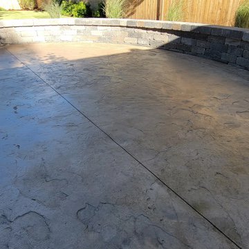 Kupfer Residence - Updated backyard with new design on hardscape and landscaping. Demo old backyard and disposal of material. We did a textured stamp patio with a strassen wall for sitting wall. Did some planting and redesign garden beds with natural mulch. It was having some drainage problem and had to regrade and build a dry creek for water solution drainage.