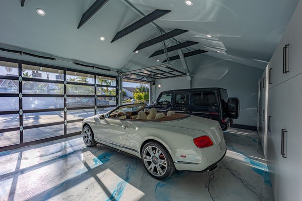 Stunning Garage Transformation by HQ Remodeling & Design in Huntington Beach, CA - Transform your home's functionality and aesthetics with HQ Remodeling & Design. Our latest project showcases our commitment to excellence and attention to detail, combining innovative designs with high-quality craftsmanship. Experience the durability and sleek look of a custom metal epoxy garage floor, designed to withstand heavy use while enhancing your garage's appearance. Elevate your space with a stunning vaulted ceiling that adds a sense of grandeur and openness to your home. Our custom garage doors are tailored to your specific needs, providing both security and curb appeal. Maximize your storage with custom cabinets that blend seamlessly with your home's design, and ensure your property stays dry and protected with a professionally installed French drain.
Enjoy a robust and visually appealing driveway that features a custom joints design for added elegance and longevity. Add a touch of nature to your property with beautifully designed planters that complement your landscape. Secure your home with stylish and durable metal gates and fences, crafted to enhance your property's overall look. Upgrade your indoor and outdoor spaces with expertly installed tiles that add beauty and practicality. At HQ Remodeling & Design, we specialize in turning your vision into reality.
Whether it's a complete home remodel, a bathroom remodel, or a custom garage makeover, our team of experienced remodeling contractors and architect designers are here to provide top-notch service. Explore our services and discover how we can enhance your living space, from custom metal epoxy garage floors to beautiful tile installations. Contact us today to start your next project and experience the difference in quality and design excellence with HQ Remodeling & Design. Stunning Garage Transformation by HQ Remodeling & Design in Huntington Beach, CA - Transform your home's functionality and aesthetics with HQ Remodeling & Design. Our latest project showcases our commitment to excellence and attention to detail, combining innovative designs with high-quality craftsmanship. Experience the durability and sleek look of a custom metal epoxy garage floor, designed to withstand heavy use while enhancing your garage's appearance. Elevate your space with a stunning vaulted ceiling that adds a sense of grandeur and openness to your home. Our custom garage doors are tailored to your specific needs, providing both security and curb appeal. Maximize your storage with custom cabinets that blend seamlessly with your home's design, and ensure your property stays dry and protected with a professionally installed French drain.
Enjoy a robust and visually appealing driveway that features a custom joints design for added elegance and longevity. Add a touch of nature to your property with beautifully designed planters that complement your landscape. Secure your home with stylish and durable metal gates and fences, crafted to enhance your property's overall look. Upgrade your indoor and outdoor spaces with expertly installed tiles that add beauty and practicality. At HQ Remodeling & Design, we specialize in turning your vision into reality.
Whether it's a complete home remodel, a bathroom remodel, or a custom garage makeover, our team of experienced remodeling contractors and architect designers are here to provide top-notch service. Explore our services and discover how we can enhance your living space, from custom metal epoxy garage floors to beautiful tile installations. Contact us today to start your next project and experience the difference in quality and design excellence with HQ Remodeling & Design.