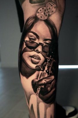 Portraits - We have artists that specialize in the timeless look of black and grey portraits. Memorialize that loved one with a stunning tattoo@